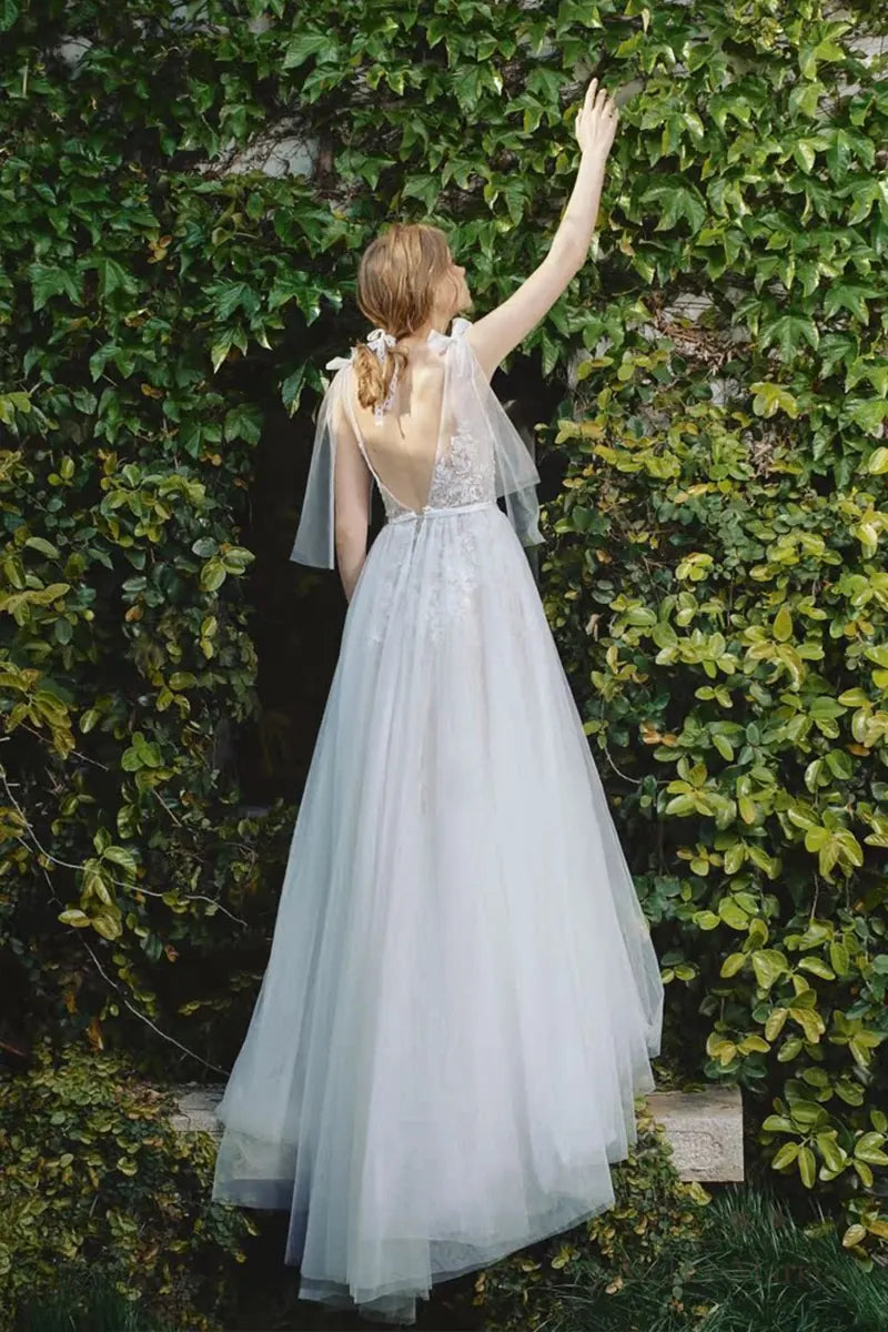 Robe de mariée bohème sur-mesure avec dos nu et dentelle fine, idéale pour mariage champêtre