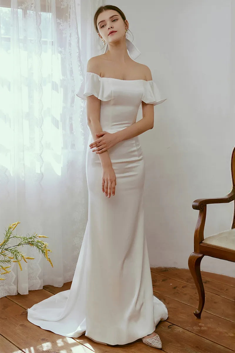 Bohemian boat neck wedding dress with a delicate short train, perfect for a civil ceremony