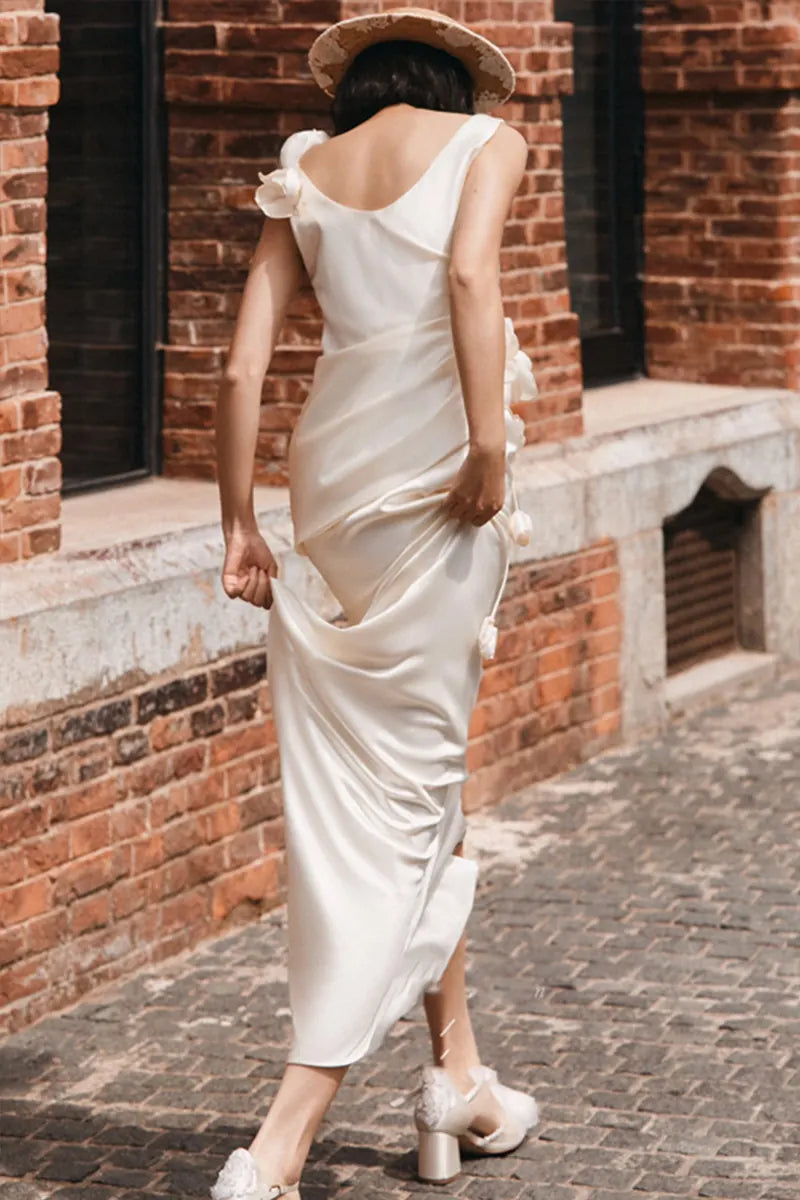 Bohemian civil wedding dress in flowing ivory satin with delicate floral embroidery