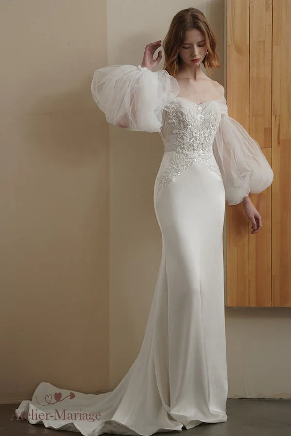 Accessoire de mariée : manches ballon amovibles offrant un look 2-en-1 romantique.