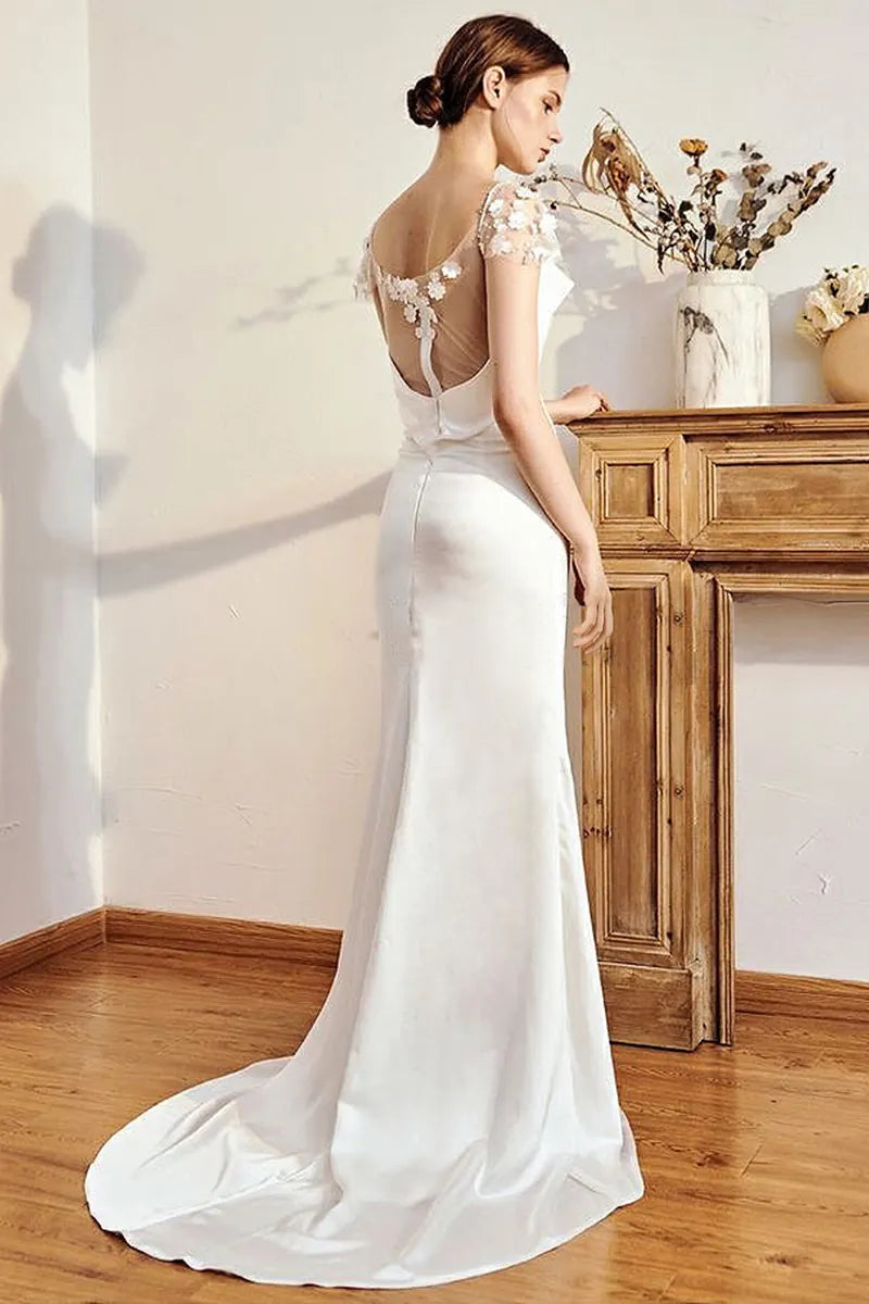Superbe dos nu sur une robe de mariée en satin sur-mesure.
