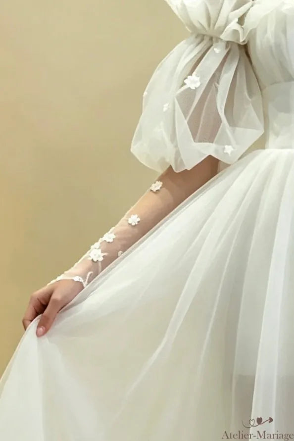 Manches bouffantes amovibles en tulle souple offrant un grand confort au biceps