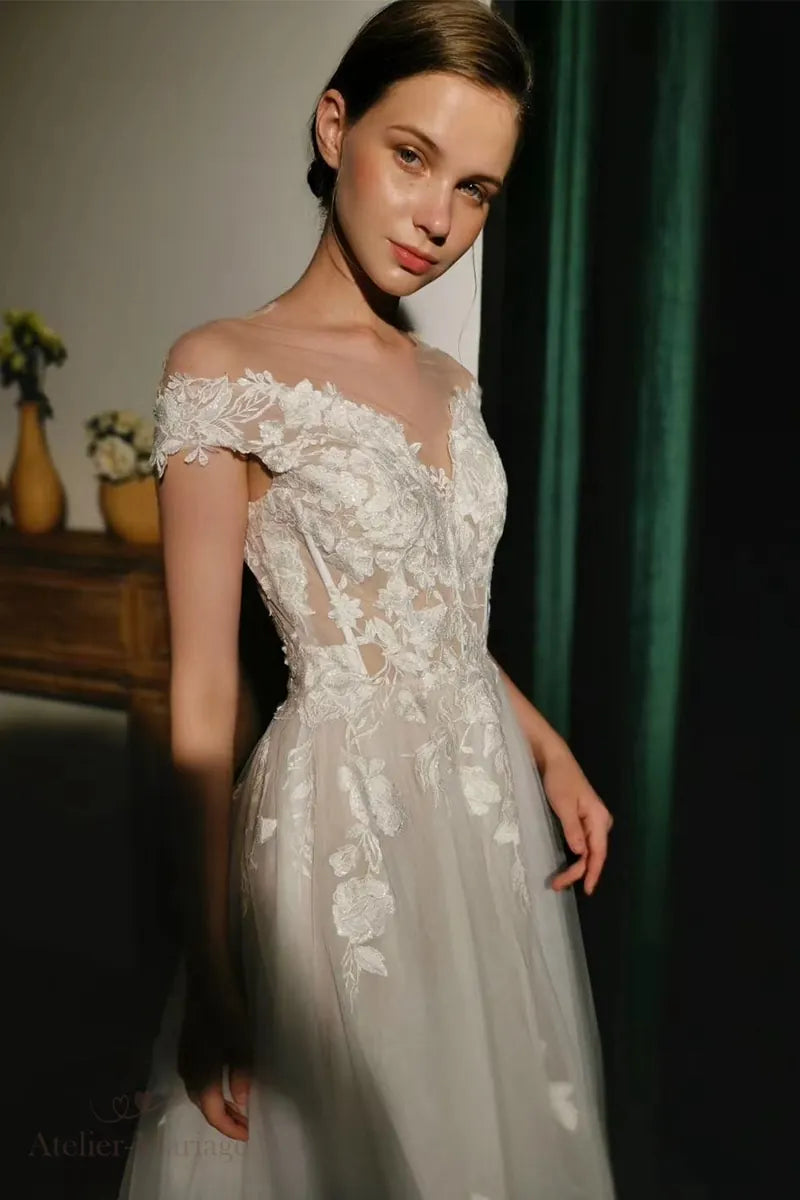 Robe de mariée col bateau en dentelle bohème champêtre élégante