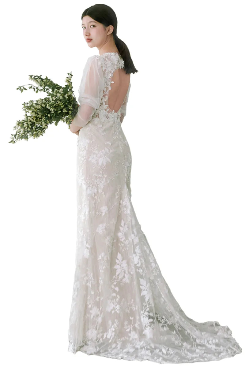 Vue arrière de la robe de mariée longue à manches bouffantes bohème chic