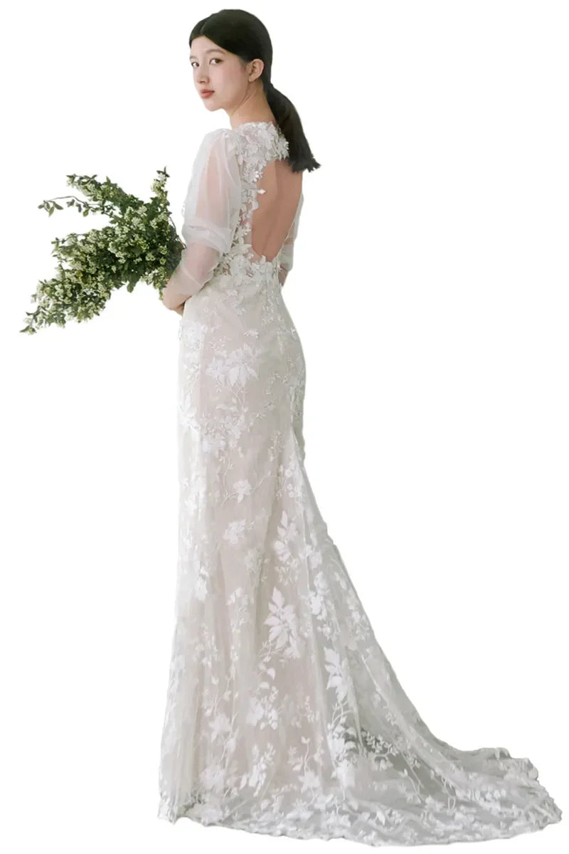 Vue arrière de la robe de mariée longue à manches bouffantes bohème chic