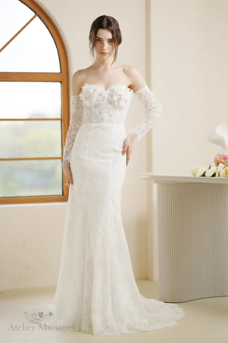 Rustic bohemian mermaid wedding dress with long lace sleeves and open back - perfect for an outdoor wedding