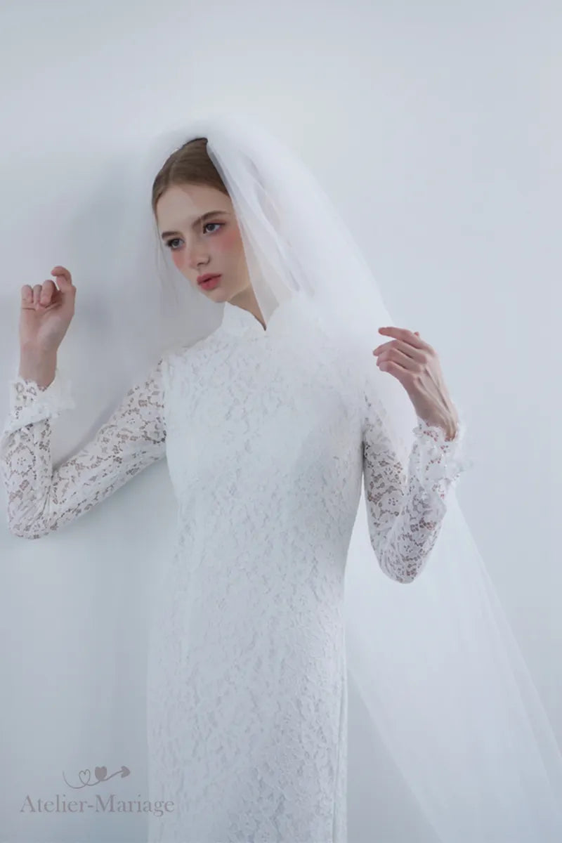 Mariée portant une robe orientale bohème vintage avec voile