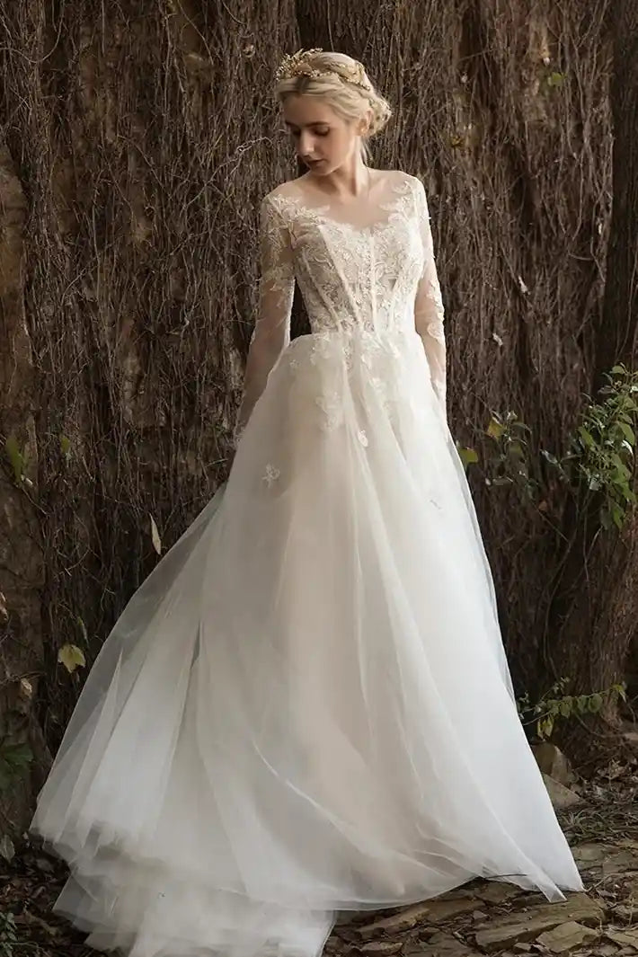 Robe de mariée romantique dentelle manches longues tulle princesse face