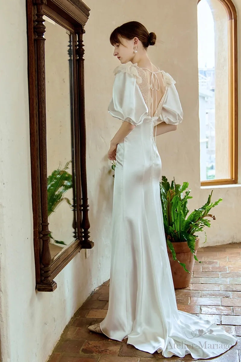 Robe de mariée fluide en satin de soie avec dentelle vintage - vue de dos montrant tombé naturel et détails artisanaux