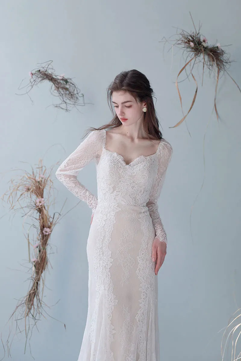 Robe mariée coupe sirène taille cintrée dentelle florale manches ajustées