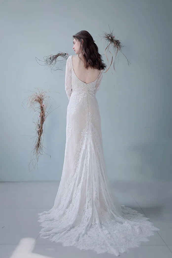 Robe de mariée sirène dentelle manches longues dos nu traîne cathédrale