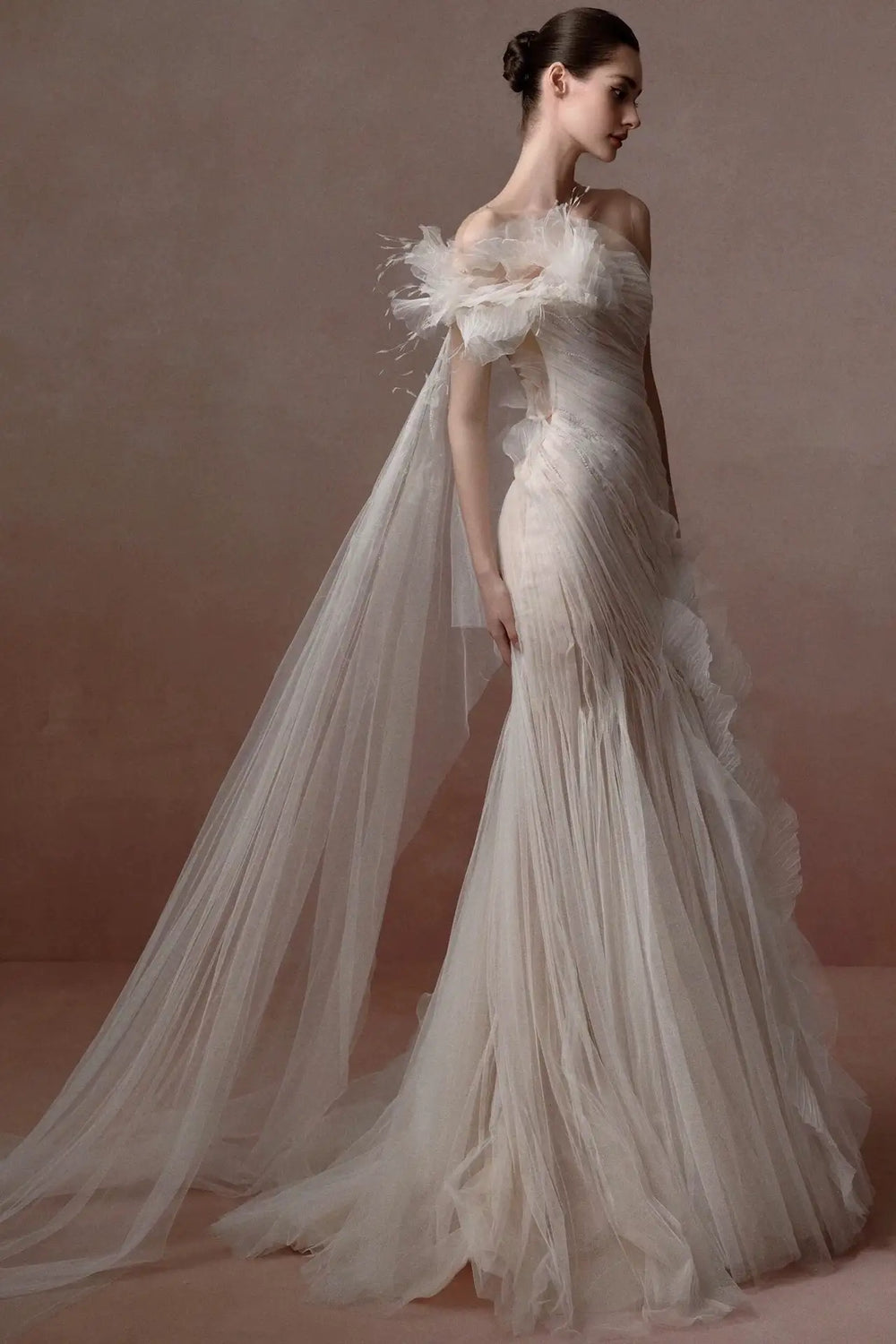 Soft tulle haute couture dress with feather and 3D flower details